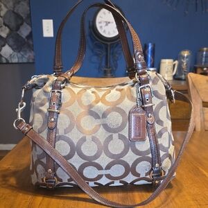 Coach Alexandra Tote Bag featuring a signature "Op Art" canvas pattern.